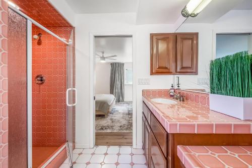 a bathroom with a shower and a sink and a toilet at Brighton Bungalow in San Diego