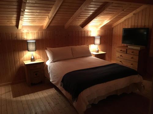 Ένα ή περισσότερα κρεβάτια σε δωμάτιο στο Chalet Olimon