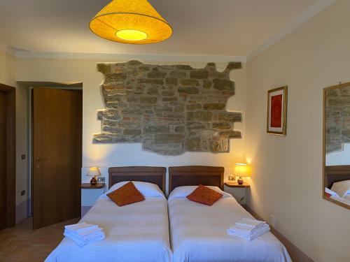 Ένα ή περισσότερα κρεβάτια σε δωμάτιο στο Agriturismo KeBio I Tenuta di Fassia