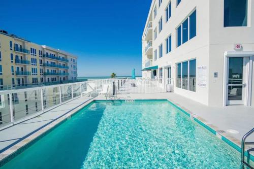 a swimming pool on the balcony of a building at The Avalon Club in Clearwater Beach