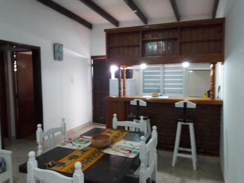 a kitchen with a table and chairs and a counter at Dptos Astrada in Goya