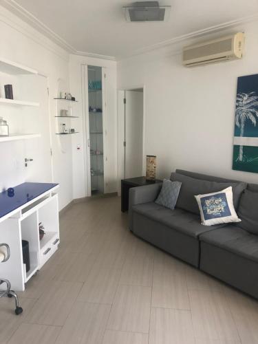 a living room with a couch and a table at Royal Ibirapuera Park in São Paulo