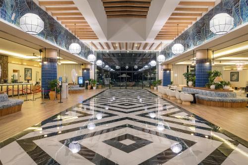 a lobby of a hotel with a large tile floor at Ocean Eden Bay - Adults Only - All Inclusive in Falmouth