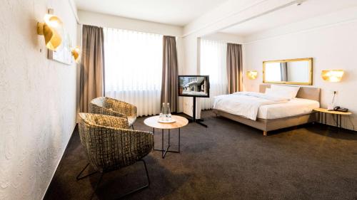 Ένα ή περισσότερα κρεβάτια σε δωμάτιο στο Best Western Hotel Mainz