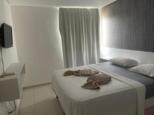 Postel nebo postele na pokoji v ubytování Carneiros Beach Resort - Flat