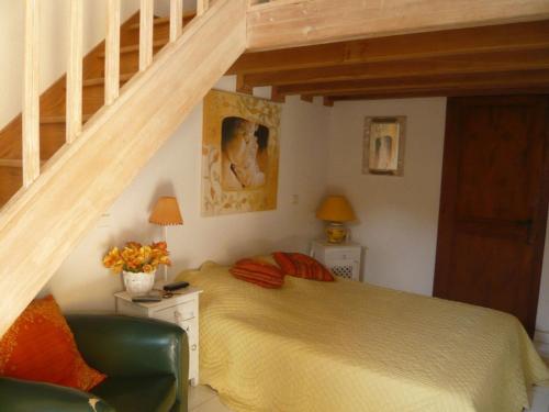 a bedroom with a bed and a staircase at Villa in Sainte-Maxime near La Nartelle Beach in La Nartelle