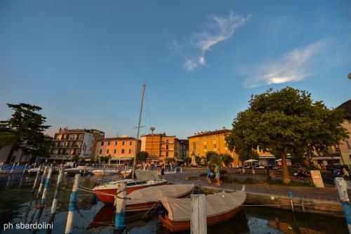 a group of boats are docked in a harbor at AMBRA HOTEL - The only central lakeside hotel in Iseo in Iseo
