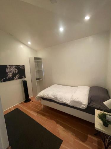 a bedroom with a bed and a book shelf at Culver City Hostel in Los Angeles