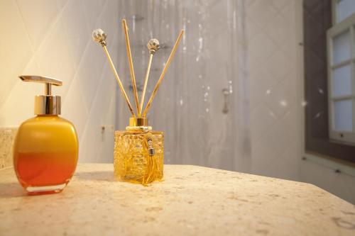two vases sitting on top of a table at Teatro Hotel Boutique in Ouro Preto