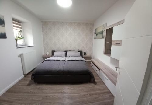 Säng eller sängar i ett rum på Am Steinweg