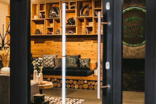 a door leading into a room with a bench at Harda House Friends & Spa in Zakopane
