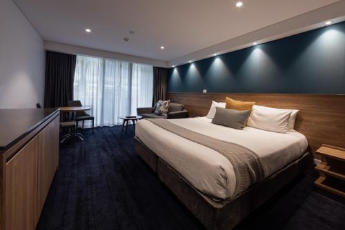 Säng eller sängar i ett rum på The Executive Inn, Newcastle