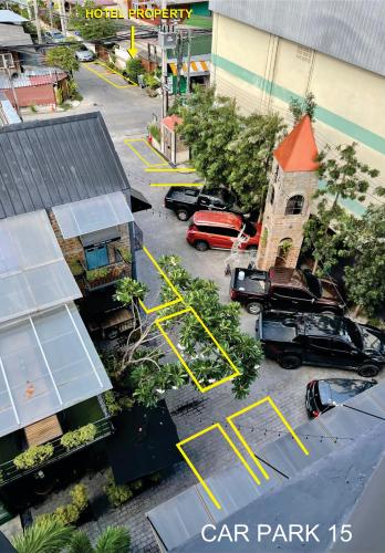 an aerial view of a parking lot with a car park at BOOK Design Hotel in Chiang Mai
