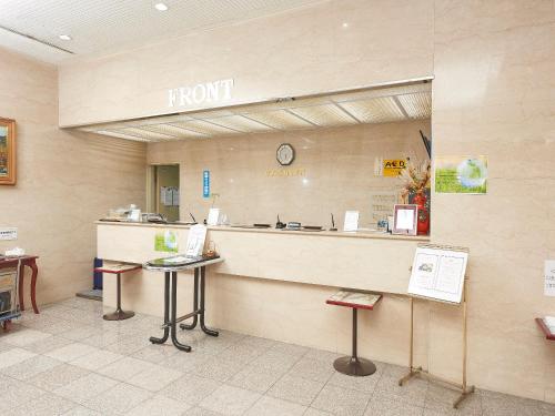 a lobby with a front counter in a hospital at Famy Inn Makuhari in Chiba