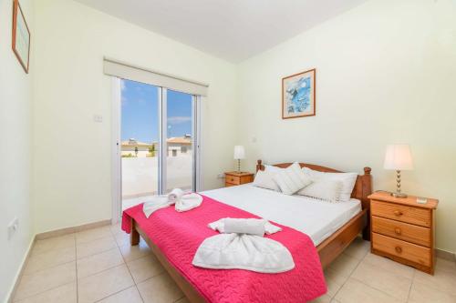 Llit o llits en una habitació de Villa Alexander