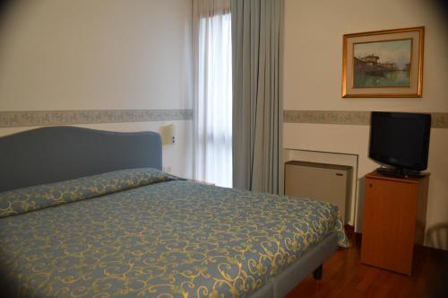 Postel nebo postele na pokoji v ubytování Hotel Sagittario
