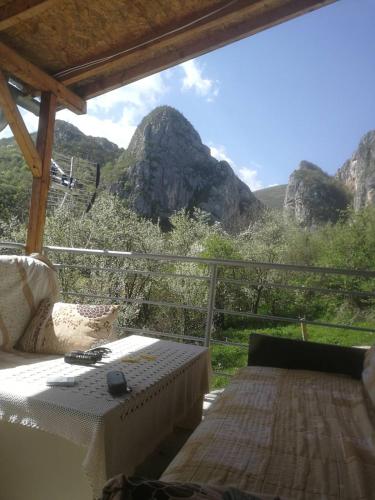 a balcony with a view of a mountain at Odmaralište Vlaško ždrelo in Pirot