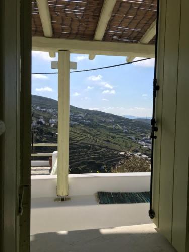 an open window with a view of a valley at Villa Meltemi in Arnados