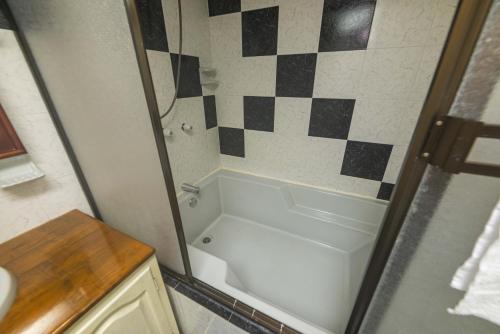 a bathroom with a shower and a white bath tub at Casa Los Patios in Jericó