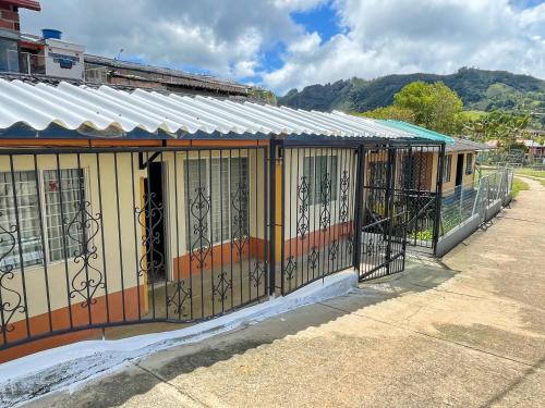 a building with a gate on the side of it at Casa Los Patios in Jericó