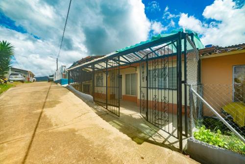 a building with a gate on the side of a street at Casa Los Patios in Jericó