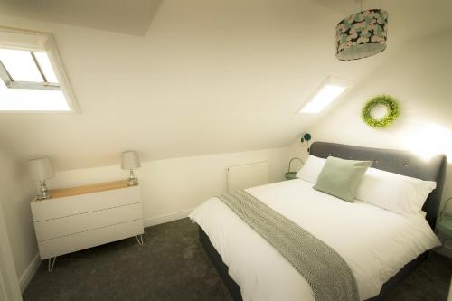 Кровать или кровати в номере Eider Cottage