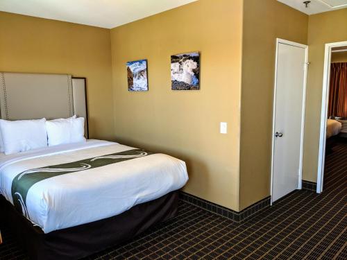 a hotel room with a large bed in it at Quality Inn & Suites Westminster Seal Beach in Westminster