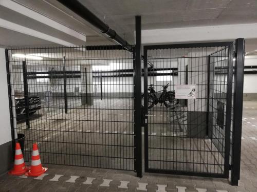 a cage in a building with orange and white cones at Best Western Plus Hotel Füssen in Füssen