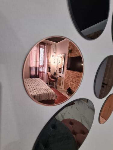 a mirror reflection of a room with a bed at Premium class Apartmant - free parking in Zadar