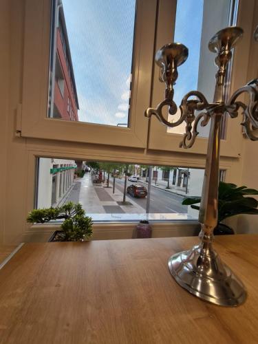 a candle on a table in front of a window at Premium class Apartmant - free parking in Zadar