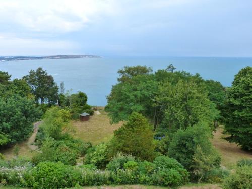 a garden with a view of the water at Sea View in Shanklin