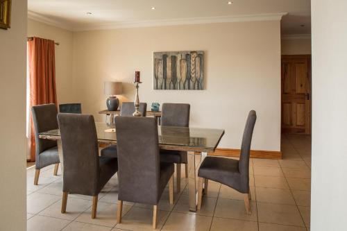 a dining room with a table and chairs at Once Upon a Tide in Clifden