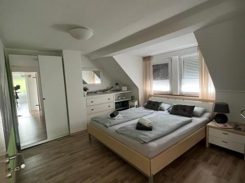 a bedroom with a large bed in a room at Xantener Ferienhaus Heeser Weg in Xanten