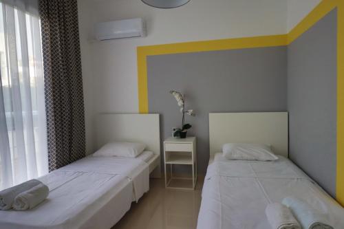 Katil atau katil-katil dalam bilik di Caesar Beach Villas and Apartments