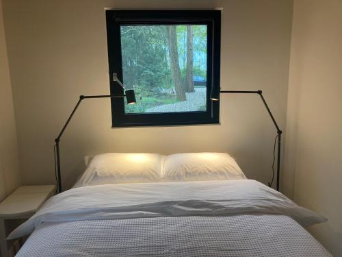 Ένα ή περισσότερα κρεβάτια σε δωμάτιο στο 'T Zand Bed & Breakfast