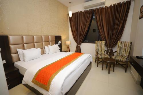Ένα ή περισσότερα κρεβάτια σε δωμάτιο στο JM Vistaraa