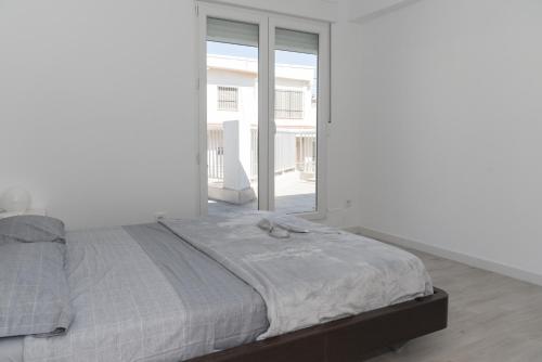 Postel nebo postele na pokoji v ubytování MIRALMAR del FARO, B-6-21