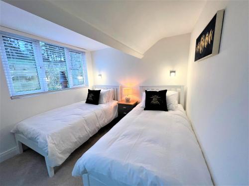 En eller flere senge i et værelse på Beautiful House Located Near Kielder Reservoir