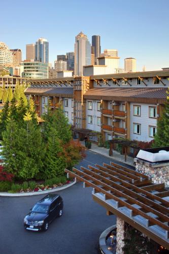 a car parked in a parking lot in front of a building at The Edgewater, a Noble House Hotel in Seattle
