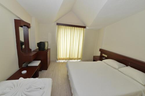 Postel nebo postele na pokoji v ubytování Kaftans City Hotel by RRH&R