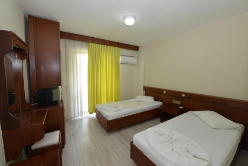 Postel nebo postele na pokoji v ubytování Kaftans City Hotel by RRH&R