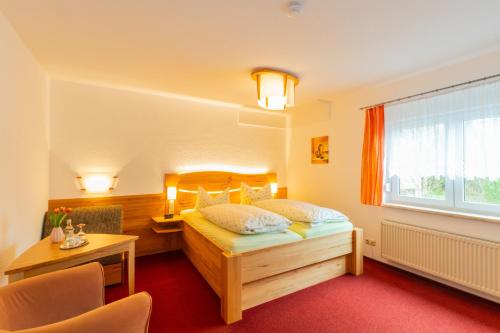 Voodi või voodid majutusasutuse Rennsteighotel Grüner Baum toas