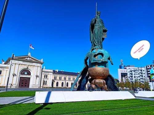 a statue in front of a building at Apartment Alloga in Belgrade