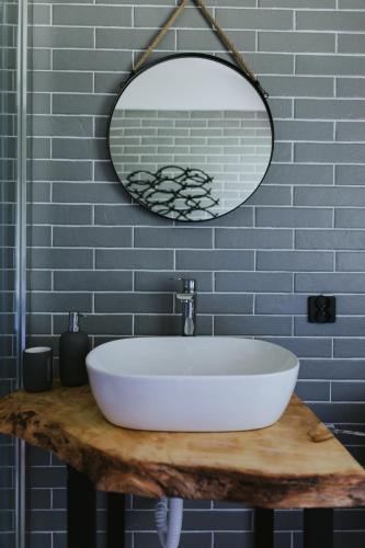 a bathroom with a white sink and a mirror at Weź tu Przystań - Mikołajek 1 in Pomiechówek