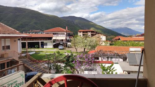 a view of a town with mountains in the background at Alexandros Guesthouse in Órma