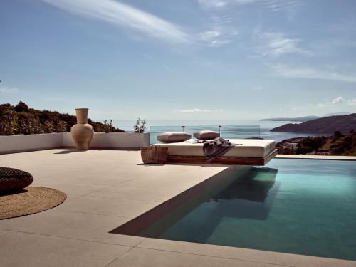 a swimming pool with a view of the ocean at The Sall Suites Complex A - Iconic Sea Views, by ZanteWize in Agios Nikolaos