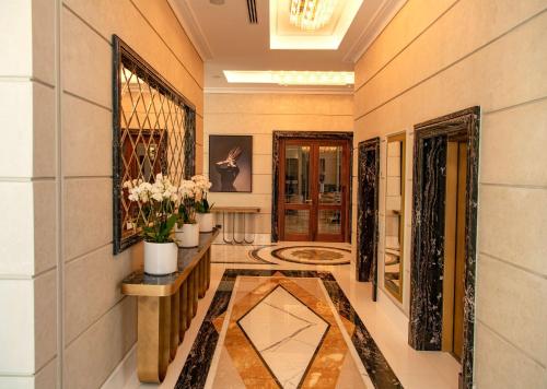 a hallway of a home with a vase of flowers at Radisson Collection Morina Hotel, Tirana in Tirana