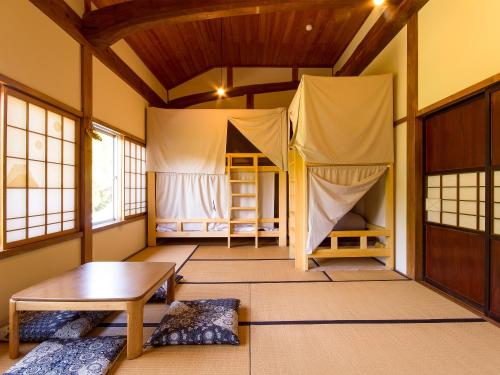 Postel nebo postele na pokoji v ubytování Guest House Takazuri-KITA