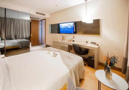 Dosso Dossi Hotels & SPA Downtownにあるベッド