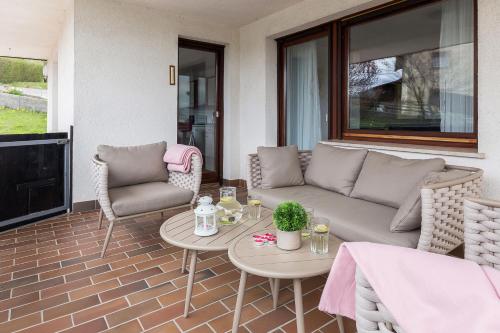 a living room with a couch and chairs and a table at Apartment Valy - Relaxing Terrace & Near Bled in Bled